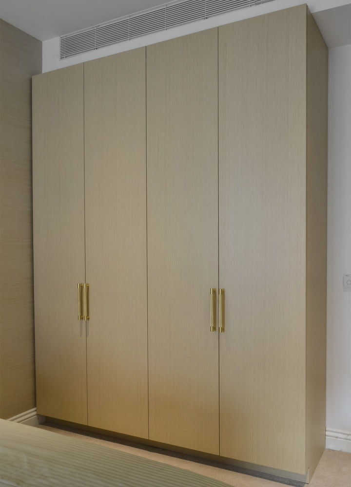 Double Hanging Fitted Wardrobe - Front View - Bespoke built-in wardrobe design. Fitted Wardrobe. Design, manufacture and installation service. Wardrobe door made from Oak veneered MDF. Wardrobe interior made from MFC in linen texture finish. Wardrobe inte