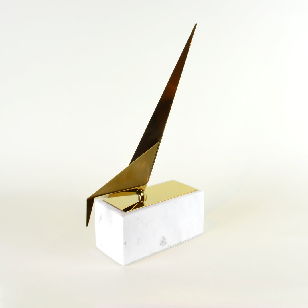 Marble Bowing Origami Bird - View 1 - Contemporary Decorative Object. Inspired by the Japanese origami art. Gold colour ornament with calacatta marble base. Origami Bird Sculpture. Materials: Nickel plated steel, calacatta marble. Bird theme home accessor