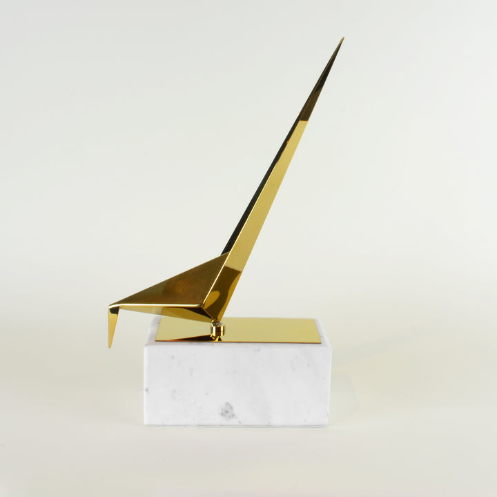 Marble Bowing Origami Bird - View 2 - Contemporary Decorative Object. Inspired by the Japanese origami art. Gold colour ornament with calacatta marble base. Origami Bird Sculpture. Materials: Nickel plated steel, calacatta marble. Bird theme home accessor