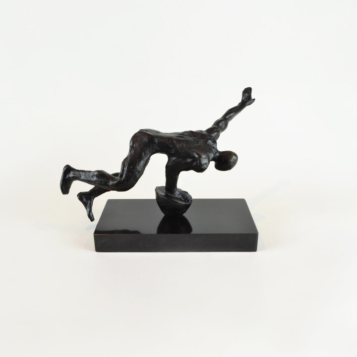 Balancing Man Sculpture - View 3 - Decorative Object / Sculpture. Black Colour. Fitness Figurine Sculpture. Black Marble base. Materials: Zinc, Marble. Dimensions: W30 D10 H16cm. Fitness theme home accessories. Muscular male figurine. Health & fitness the