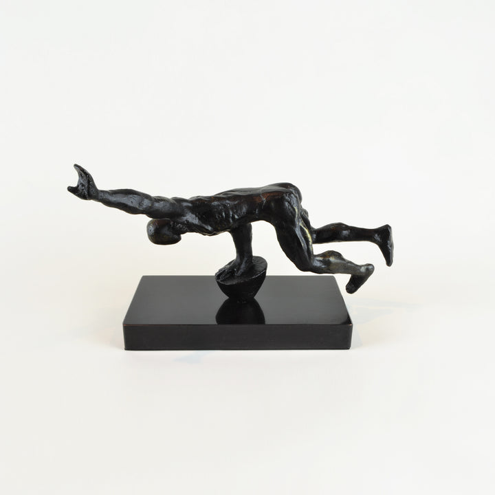 Balancing Man Sculpture - View 2 - Decorative Object / Sculpture. Black Colour. Fitness Figurine Sculpture. Black Marble base. Materials: Zinc, Marble. Dimensions: W30 D10 H16cm. Fitness theme home accessories. Muscular male figurine. Health & fitness the