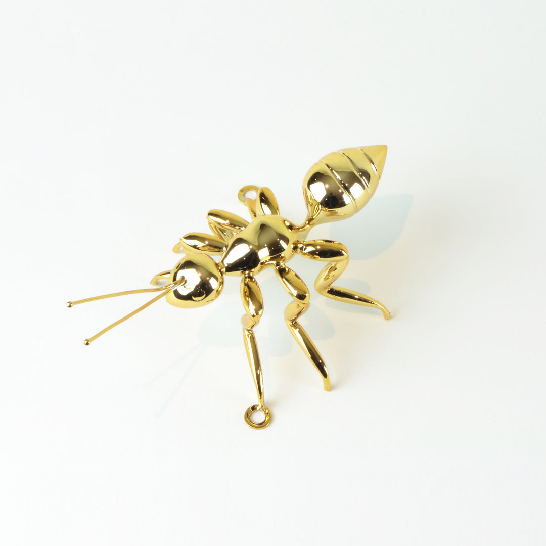 Gold Ant - View 3 - Best seller. Decorative Object / Sculpture. Gold Colour. Ant Decorative object. Can be used as a free standing ornament or wall decor. The Ant feet contains fixtures that allowed the sculpture to be hung on the wall and used as a sculp