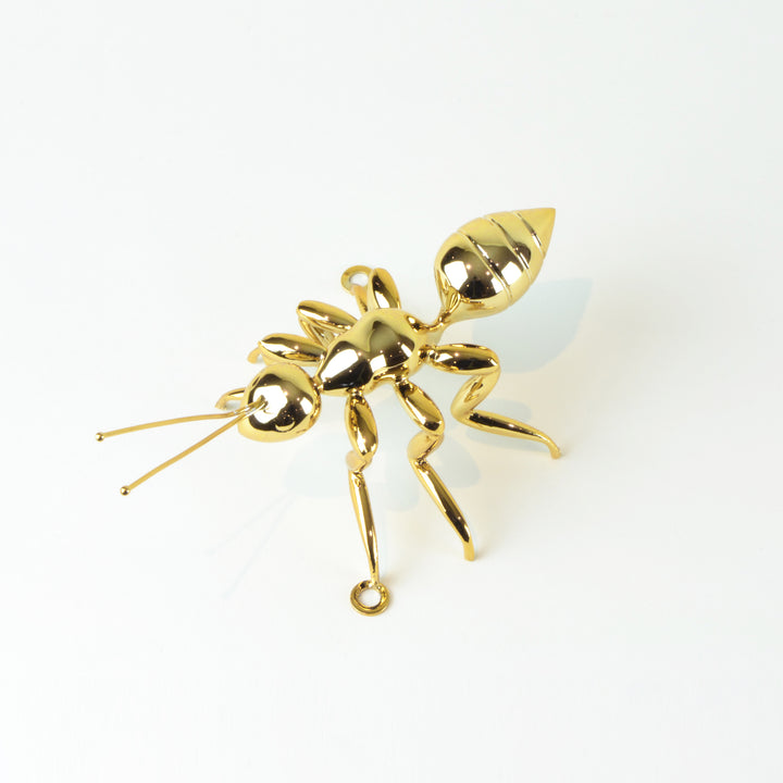 Gold Ant - View 3 - Best seller. Decorative Object / Sculpture. Gold Colour. Ant Decorative object. Can be used as a free standing ornament or wall decor. The Ant feet contains fixtures that allowed the sculpture to be hung on the wall and used as a sculp