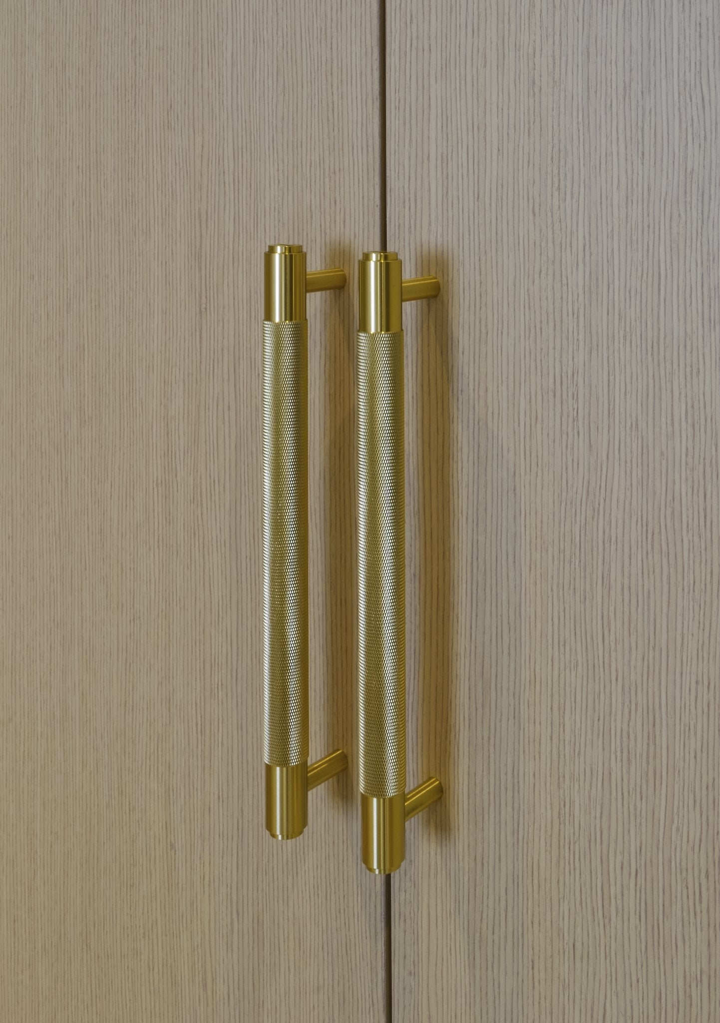 Double Hanging Fitted Wardrobe - Brass Handles - Bespoke built-in wardrobe design. Fitted Wardrobe. Design, manufacture and installation service. Wardrobe door made from Oak veneered MDF. Wardrobe interior made from MFC in linen texture finish. Wardrobe i