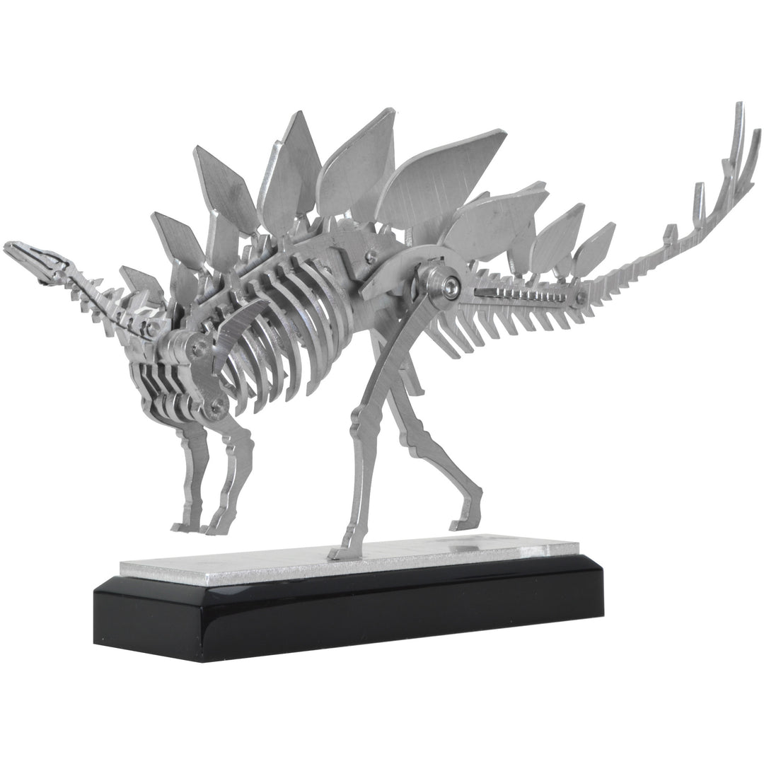 Mini Stegosaurus - View 1 - Decorative Object / Sculpture. Silver Colour. Dinosaur Sculpture. Stegosaurus skeleton ornament. Industrial chic style dinosaur object. Materials: Brushed Stainless steel. Acrylic base. Jurassic Park theme home accessories. Kid