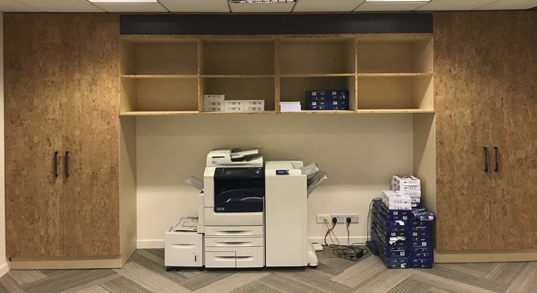 Ticker Tape Printing Station - Front View 3. Fitted printing station unit with storage space and shelves. Bespoke office printer unit. Design, Manufacture and Installation service. Office fitted joinery. Commercial office storage solution. Bespoke unit wi