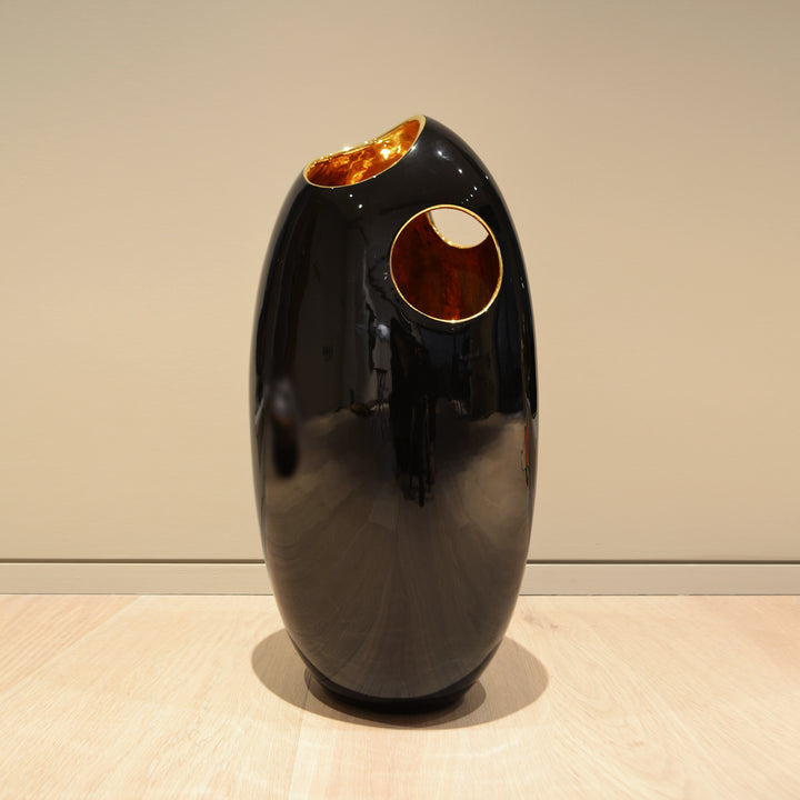 Giant Pebble Vase - Black and Gold - Ceramic Vase. Modern style Decorative object. Organic shaped vase. Pebble shaped vase. Glossy polished finish. Available in 2 colour combinations. Vase interior colour options are Platinum or Gold. Vase outside colour 