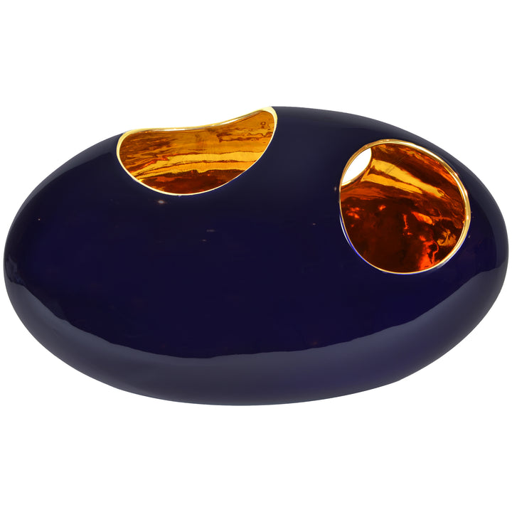 Pebble Long Vase - Midnight Blue & Gold - Large - Ceramic vase. Modern style Decorative object. Organic shaped vase. Pebble shaped vase. Glossy polished finish. Midnight Blue exterior and Gold interior colours. Materials: Ceramic. Handmade Italian ceramics. Contemporary homeware design.  Designer vase for styling coffee tables, dining tables, sideboards and console tables. Modern design ceramic home accessories that will add a luxurious touch to interiors. Pebble vases are suitable for flower arrangements.
